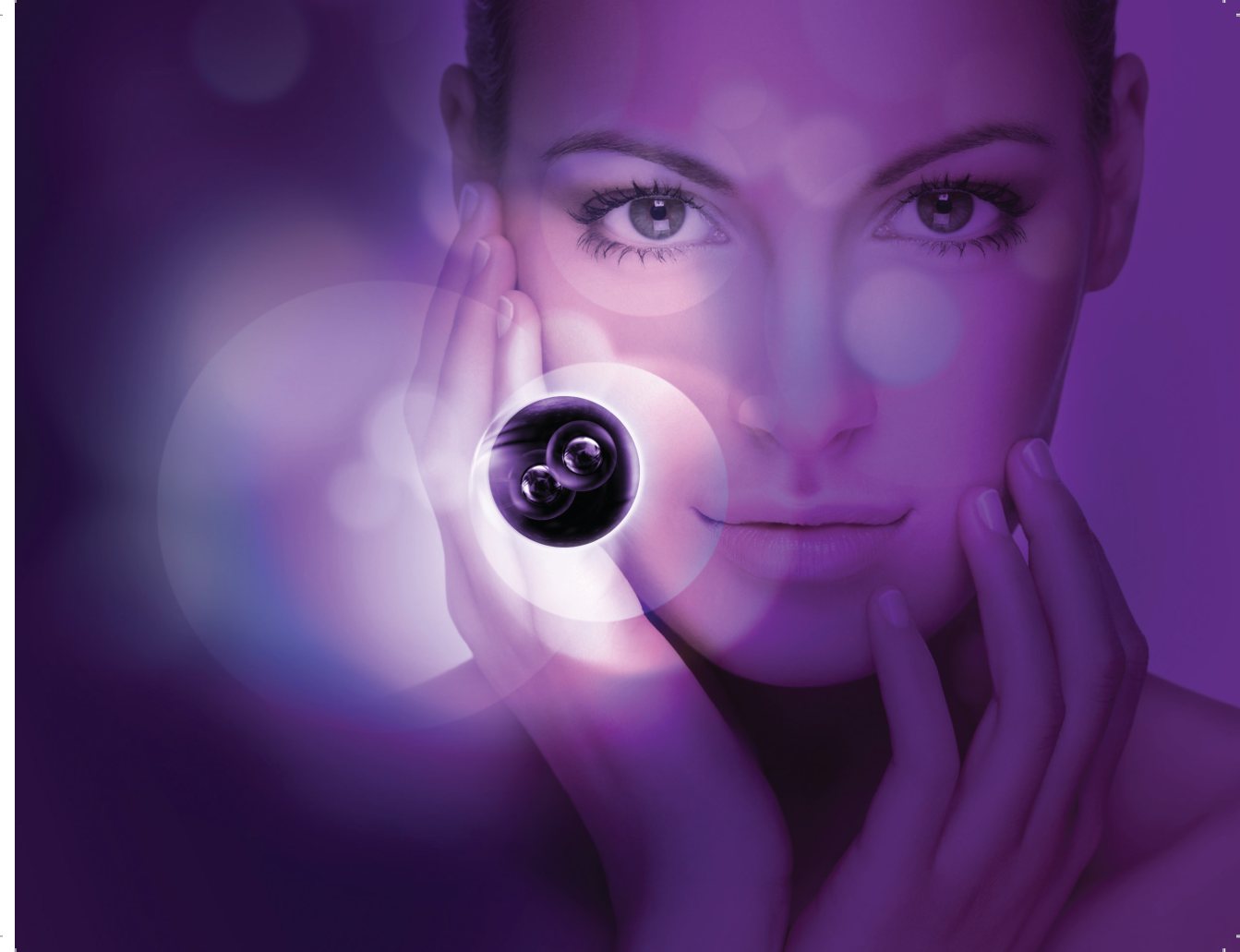 A woman holds the Global Lift cell sphere to her cheek
